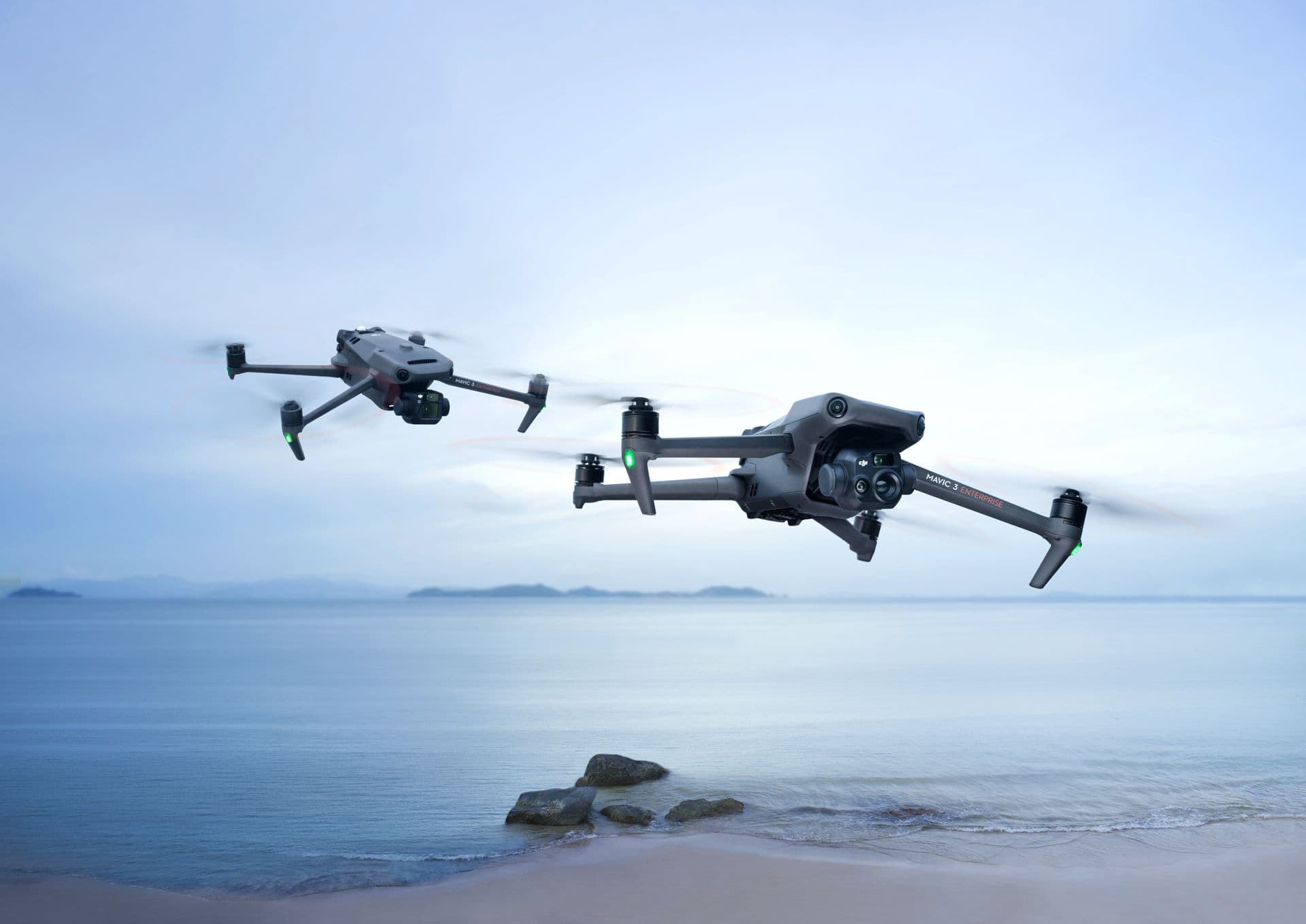 Two drones flying over a UK coastline